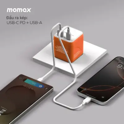 Bộ sạc du lịch MOMAX UA29 GaN 2 cổng USB-A và USB-C 20W 1-World² - Đừng để khác biệt về ổ cắm làm gián đoạn những chuyến phiêu lưu của bạn! <strong>Bộ sạc du lịch MOMAX UA29 GaN 2 cổng USB-A và USB-C 20W 1-World²</strong> là người bạn đồng hành hoàn hảo cho mọi điểm đến. Với khả năng tương thích hơn 200 quốc gia nhờ các chân cắm tích hợp thông minh, bộ sạc <strong>MOMAX UA29</strong> mang đến tổng công suất 20W đáng tin cậy nhờ công nghệ GaN tiên tiến. Với 2 cổng sạc (1 USB-C PD & 1 USB-A QC), bạn có thể nạp năng lượng cho điện thoại, máy tính bảng cùng lúc. Nhỏ gọn, an toàn và cực kỳ đa năng. <strong>MOMAX UA29</strong> - Giải pháp năng lượng thiết yếu cho mọi hành trình, giữ thiết bị của bạn luôn sẵn sàng hoạt động ở bất kỳ đâu trên thế giới.