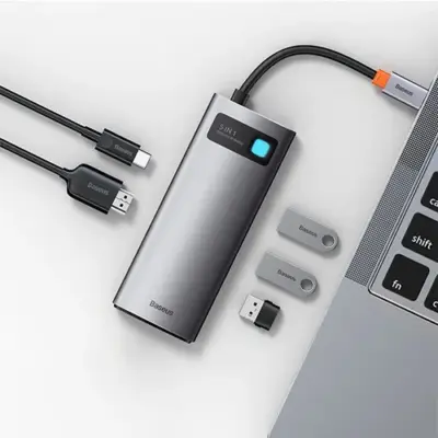 Thiết bị mở rộng hiệu Baseus Metal Gleam Series 5-in-1 Multifunctional Type-C HUB Docking Station 30Hz Version - Bạn đang tìm kiếm một giải pháp kết nối gọn gàng nhưng vẫn mạnh mẽ cho chiếc laptop Type-C của mình? Hub chuyển đổi <strong>Baseus Metal Gleam Series 5-in-1</strong> chính là câu trả lời. Sản phẩm mở rộng một cổng Type-C thành 5 cổng chức năng quan trọng nhất: HDMI 4K@30Hz cho hình ảnh sắc nét, 3 cổng USB 3.0 truyền dữ liệu tốc độ 5Gbps, và cổng sạc nhanh PD 100W. Với thiết kế vỏ nhôm nguyên khối sang trọng, tản nhiệt hiệu quả, đây là phụ kiện không thể thiếu giúp bạn tối ưu hóa không gian làm việc và nâng cao hiệu suất. Hãy đơn giản hóa kết nối của bạn với <strong>Baseus Metal Gleam Series 5-in-1</strong>.