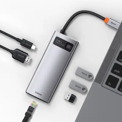 Thiết bị mở rộng hiệu Baseus Metal Gleam Series 6-in-1 Multifunctional Type-C HUB Docking Station - Giải pháp kết nối tinh gọn và mạnh mẽ cho chiếc laptop của bạn - hub chuyển đổi <strong>Baseus Metal Gleam Series 6-in-1</strong>. Với thiết kế vỏ nhôm nguyên khối sang trọng, sản phẩm mở rộng một cổng Type-C thành 6 cổng chức năng quan trọng nhất: HDMI 4K cho hình ảnh sắc nét, 3 cổng USB 3.0 truyền dữ liệu tốc độ 5Gbps, cổng mạng LAN Gigabit cho kết nối internet siêu ổn định và cổng sạc nhanh PD 100W. Đây là lựa chọn lý tưởng để tối ưu hóa không gian làm việc, giúp bạn kết nối đa nhiệm một cách liền mạch và hiệu quả. Nâng cấp trải nghiệm của bạn ngay hôm nay với <strong>Baseus Metal Gleam Series 6-in-1</strong>.